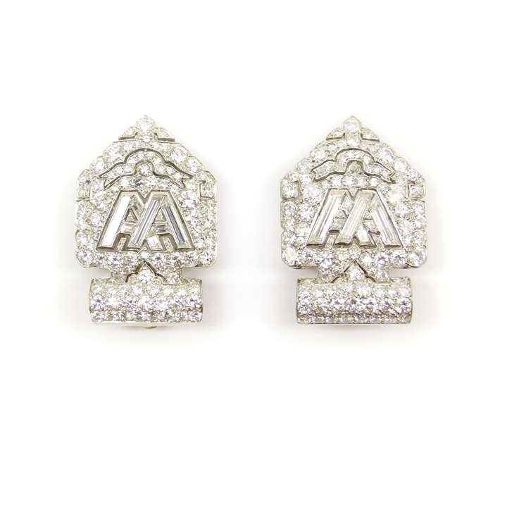 Pair of diamond arrowhead shaped clips with double 'A' initials